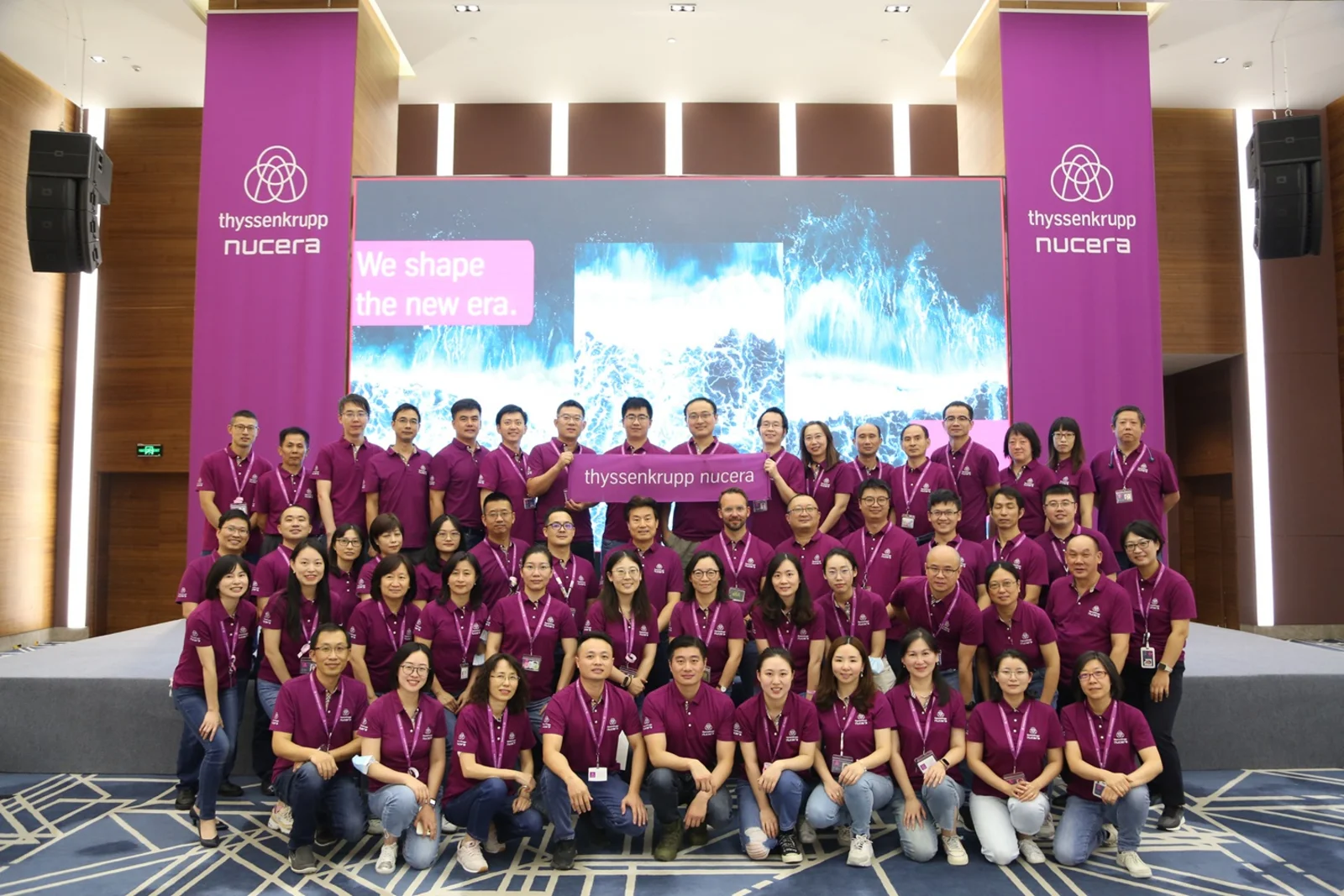 thyssenkrupp nucera China employees celebrating rebranding of brand